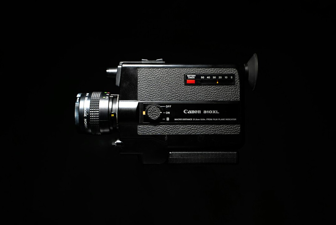Camera operator filming on a professional broadcast set